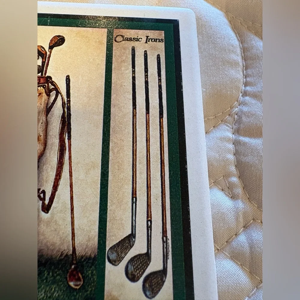Vintage ceramic coasters depicting classic golf clubs.